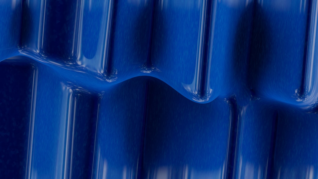 a close-up of a blue metal wall