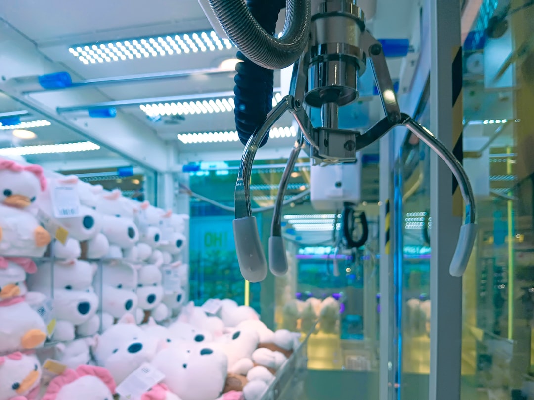 A claw machine filled with stuffed animals.