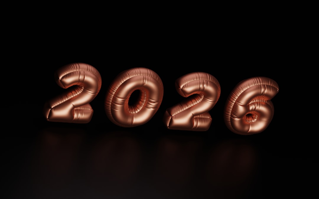 Rose gold balloons spelling out 2026