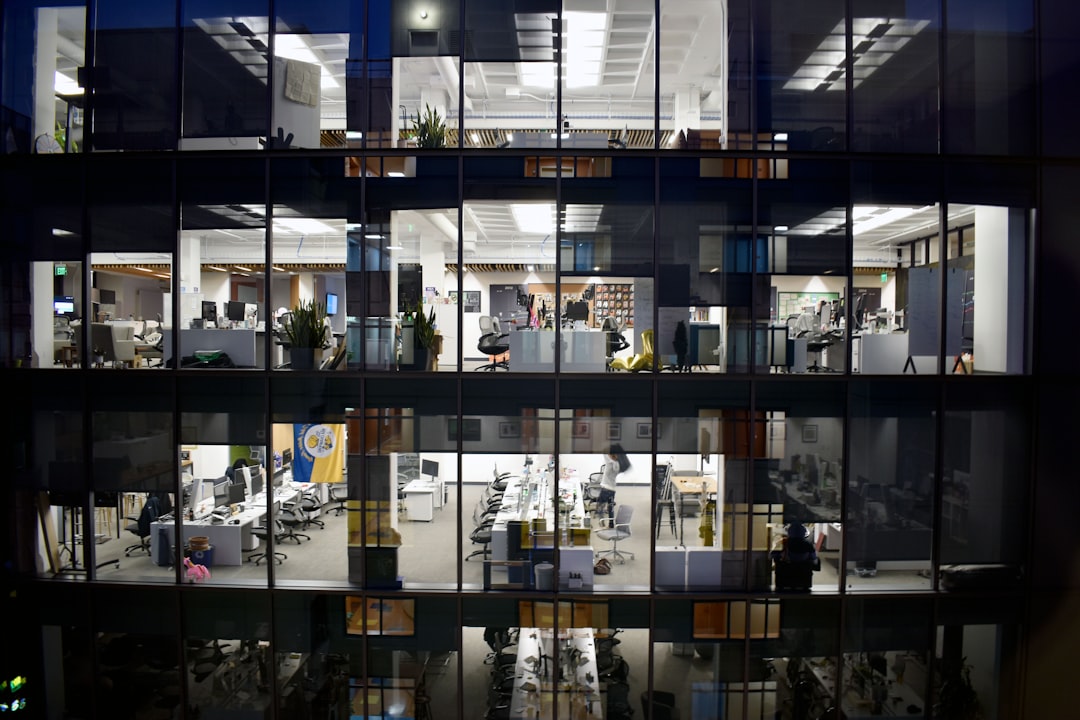an office building is lit up at night