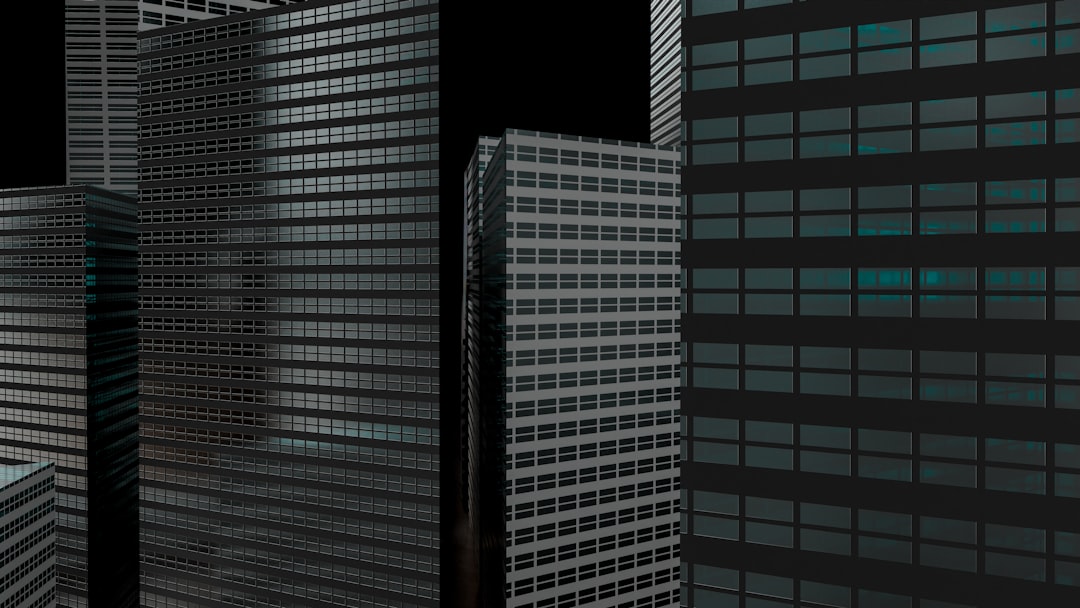 A couple of tall buildings sitting next to each other