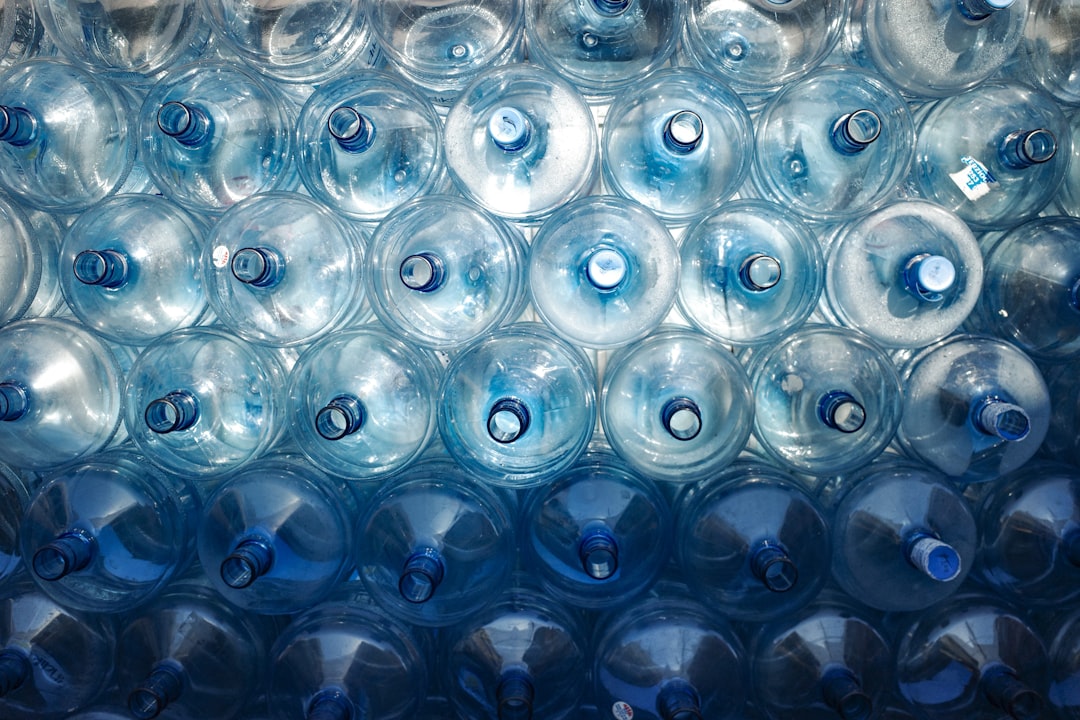 A bunch of water bottles stacked on top of each other