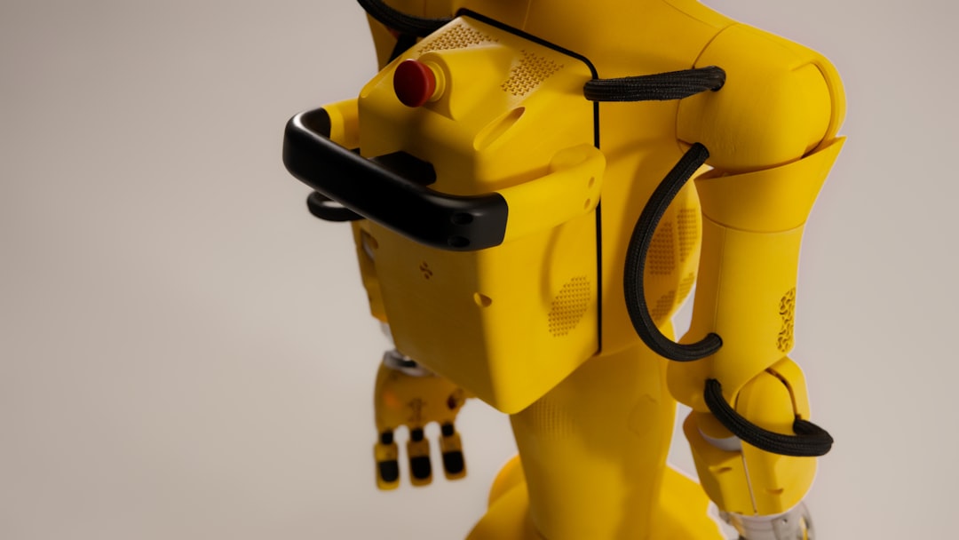 Yellow robot with black accents on a white background