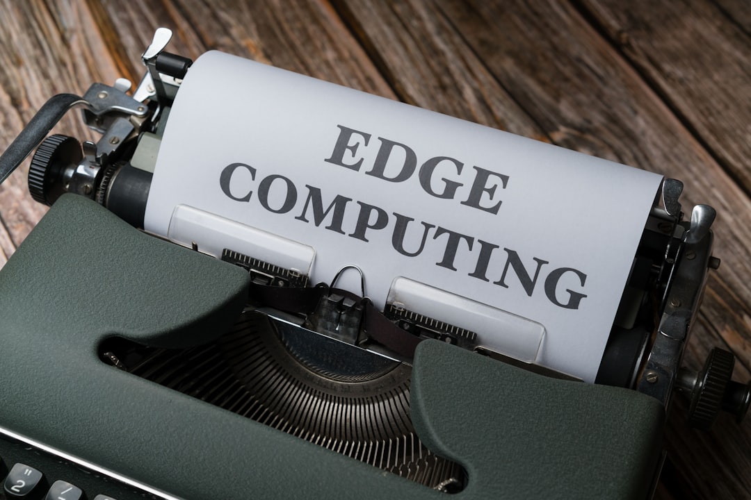 a close up of a typewriter with a paper reading edge computing