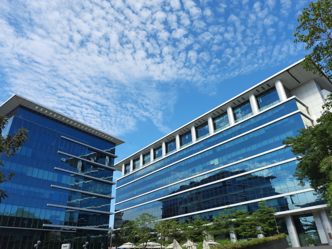 a building with a lot of windows and a sky background