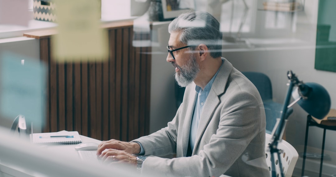 A man sitting at a desk in an office