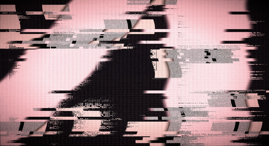 Distorted pink and black screen with digital glitch effects