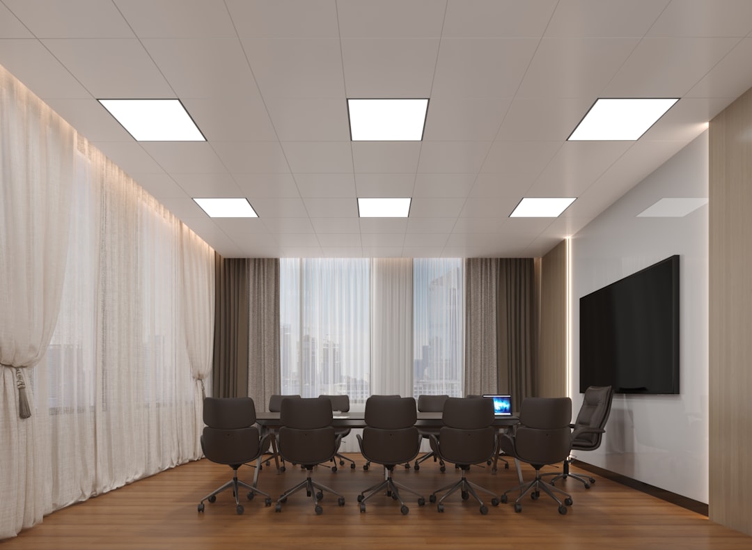 Modern conference room with large table and chairs.