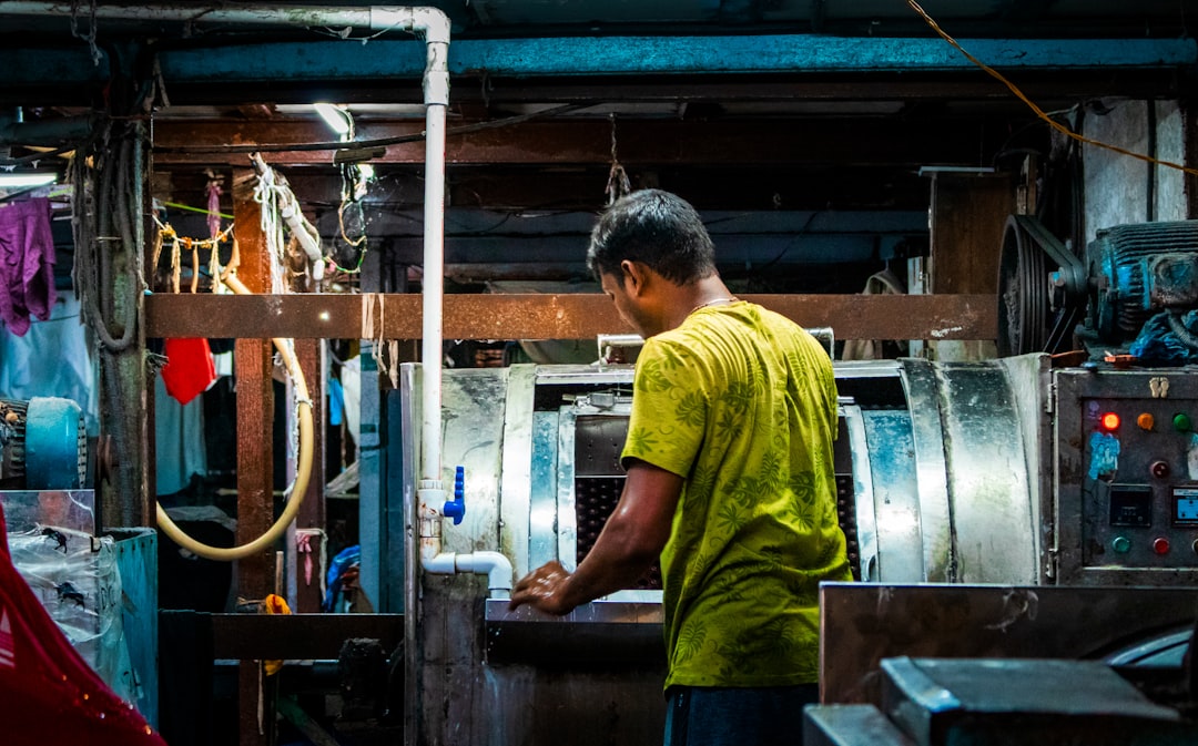 Man working in a workshop with machinery.