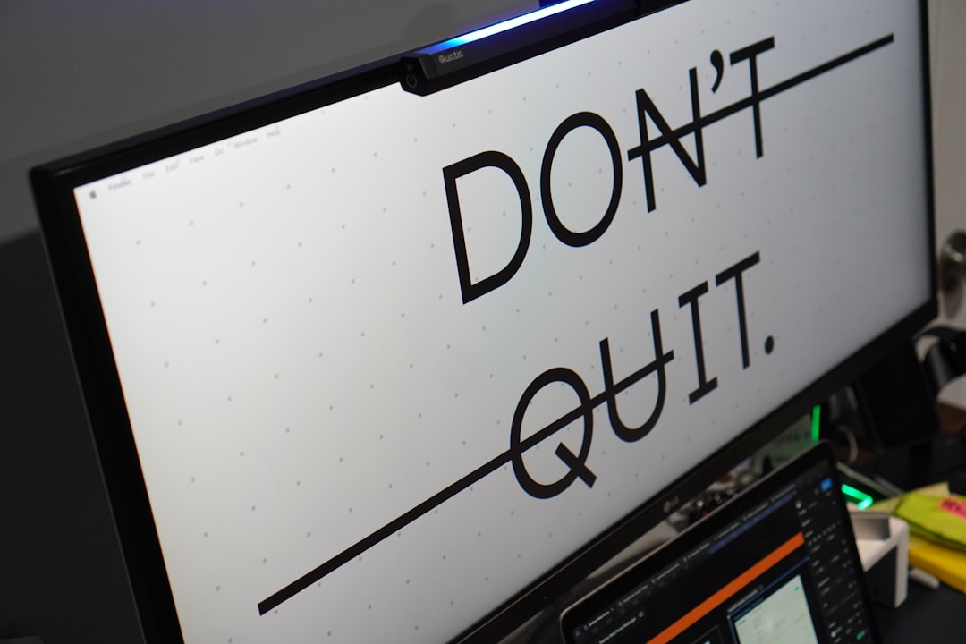 Computer monitor displays 'don't quit.' message.
