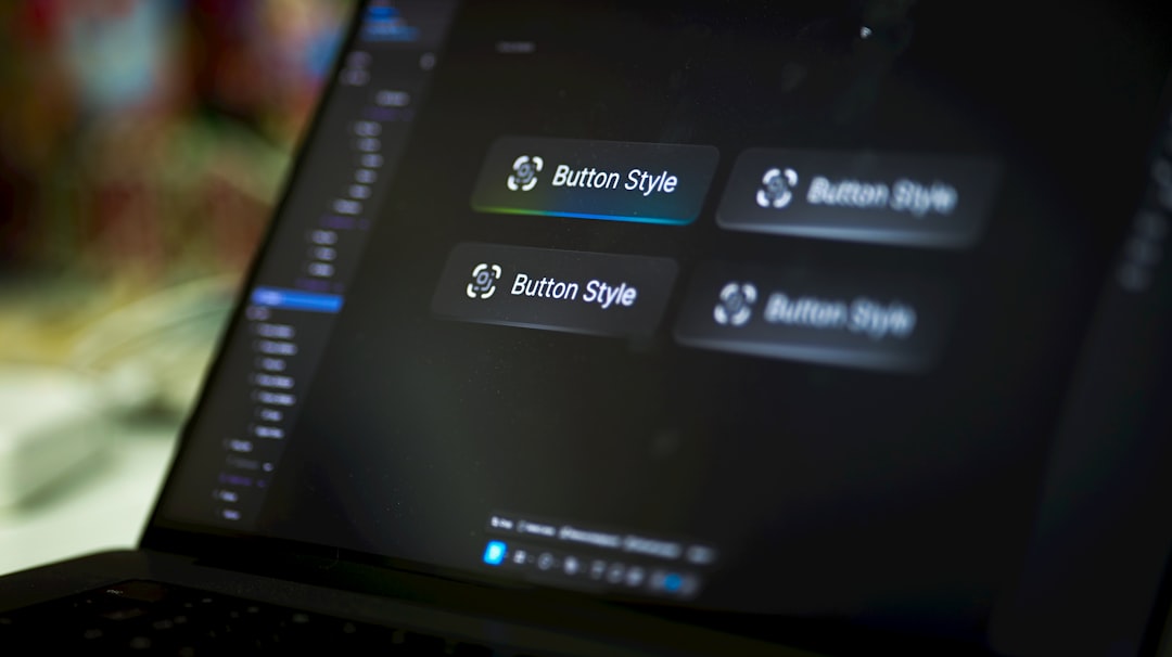 Laptop screen displays four button style options.